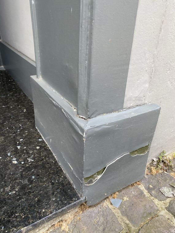 Damaged exterior woodwork before repair