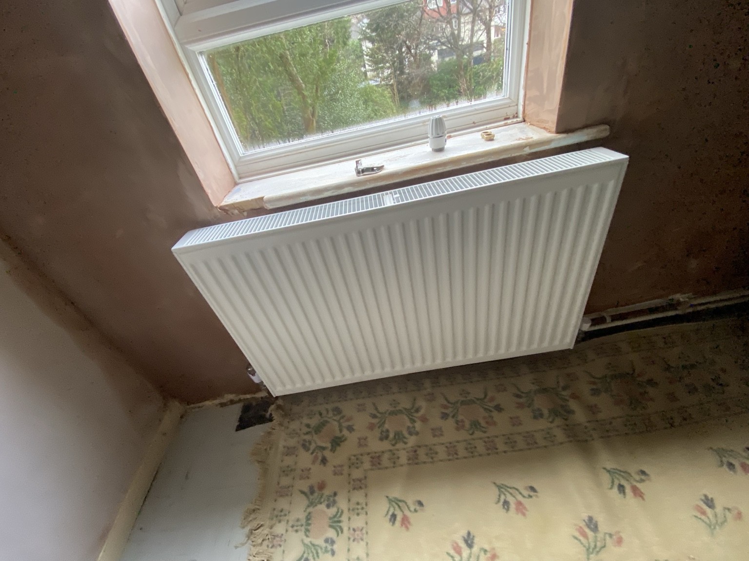 Radiator installed under window