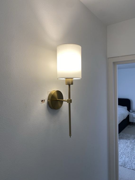 Finished wall light installation